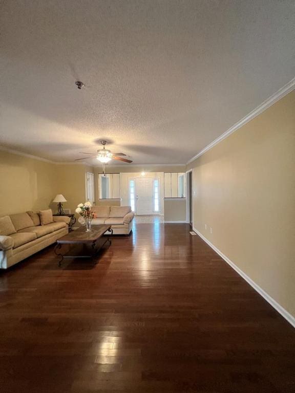 unfurnished living room featuring a textured ceiling, ceiling fan, dark hardwood / wood-style flooring, and crown molding