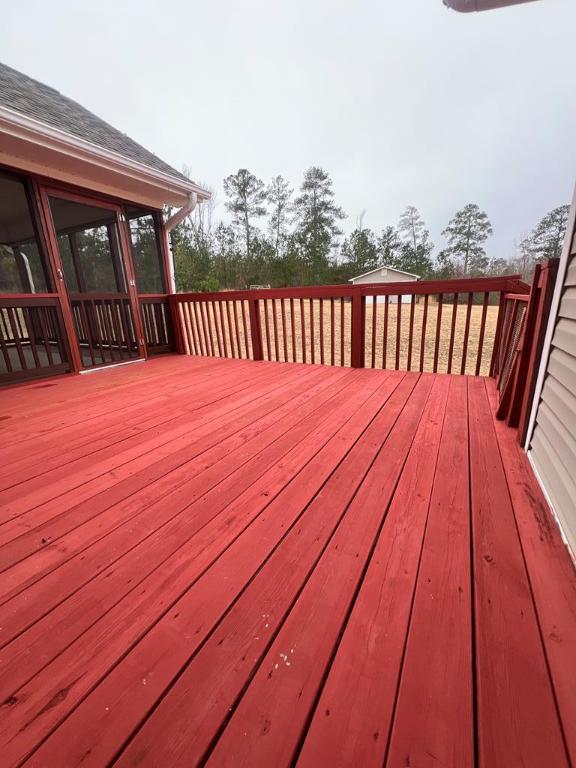 deck with a sunroom