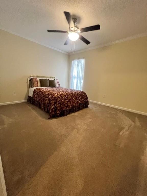 carpeted bedroom featuring ceiling fan, a textured ceiling, and ornamental molding