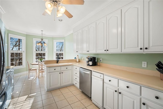 kitchen featuring white cabinets, stainless steel dishwasher, kitchen peninsula, decorative light fixtures, and light tile patterned floors