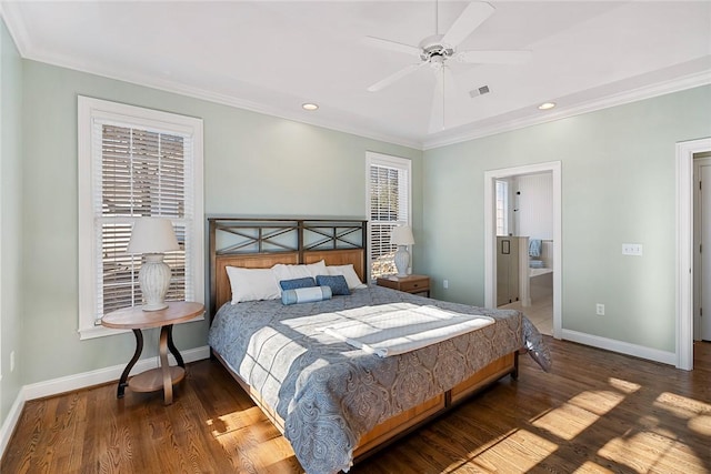 bedroom with ceiling fan, crown molding, and ensuite bathroom