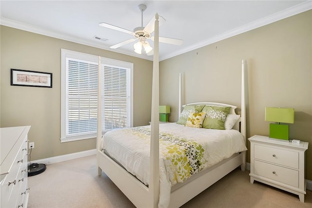 bedroom with ceiling fan, ornamental molding, and light carpet