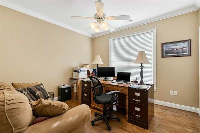 office featuring crown molding, light hardwood / wood-style flooring, and ceiling fan