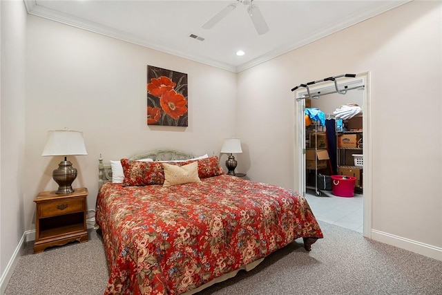 carpeted bedroom with ceiling fan and ornamental molding