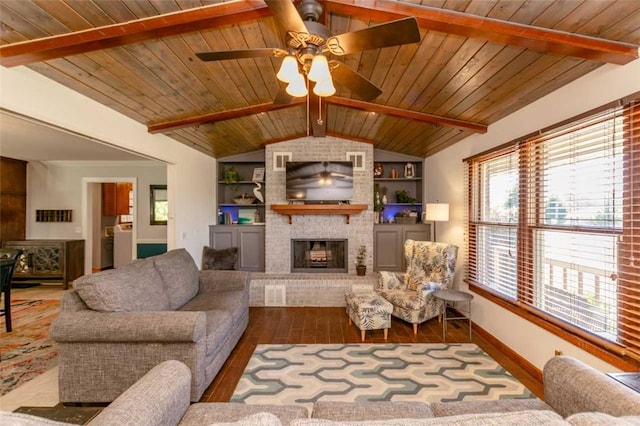 living room featuring a brick fireplace, built in features, wooden ceiling, hardwood / wood-style floors, and vaulted ceiling with beams