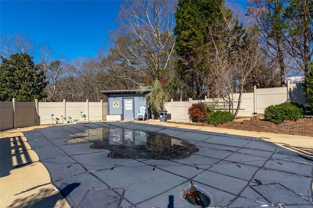 view of pool featuring a storage shed