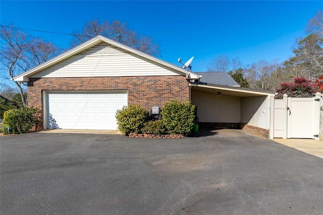 view of side of home with a garage