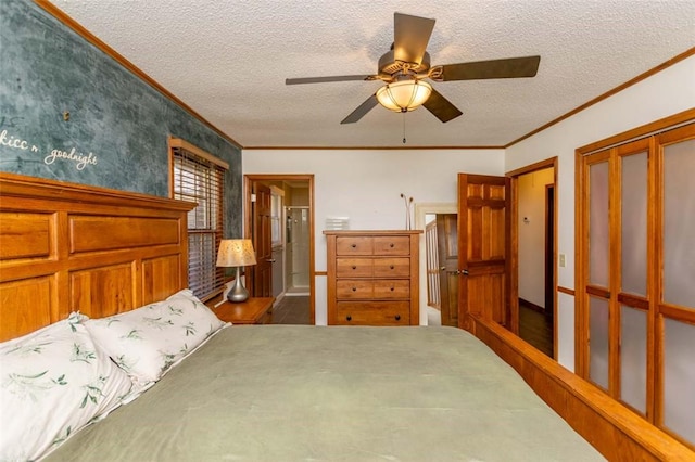 bedroom with a textured ceiling, ceiling fan, crown molding, and a closet