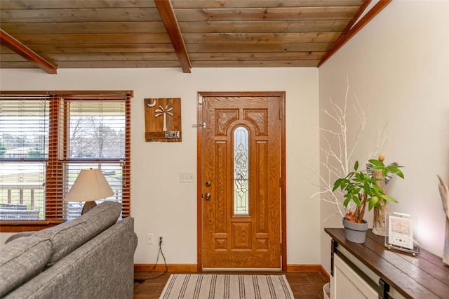 foyer entrance featuring vaulted ceiling with beams and wooden ceiling