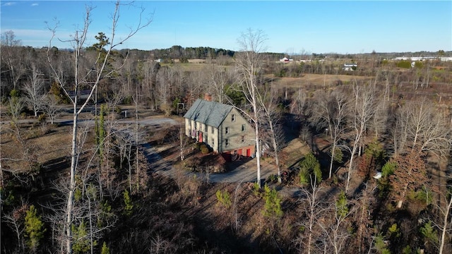 bird's eye view featuring a wooded view