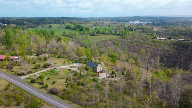 birds eye view of property with a forest view