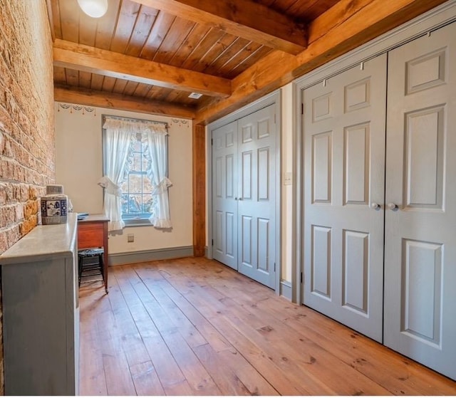 office area with beamed ceiling, wood ceiling, baseboards, and light wood-type flooring