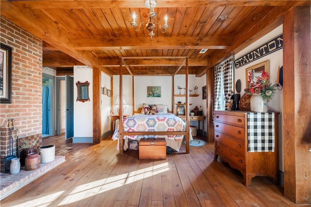 bedroom featuring a chandelier, hardwood / wood-style flooring, beamed ceiling, and wooden ceiling