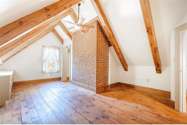 bonus room featuring baseboards, vaulted ceiling with beams, ceiling fan, and wood-type flooring