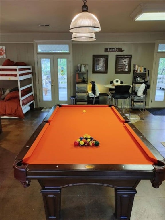 recreation room featuring billiards, a wealth of natural light, and french doors