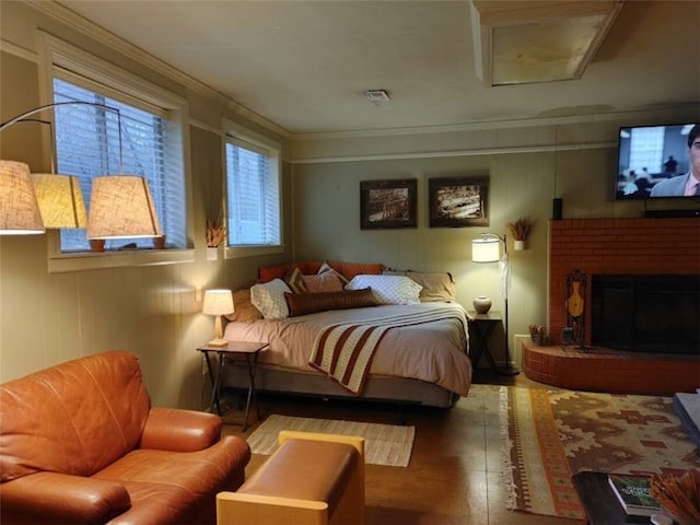 bedroom featuring a fireplace and ornamental molding