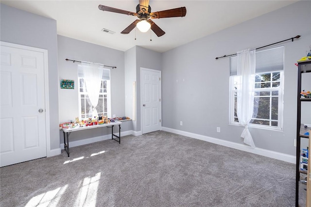 unfurnished bedroom with carpet flooring and ceiling fan