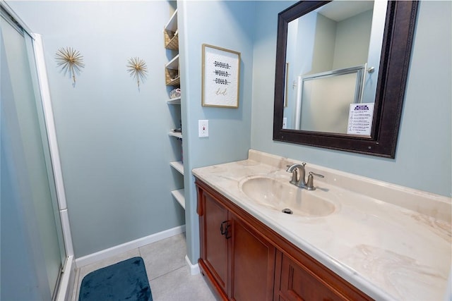 bathroom with tile patterned flooring, vanity, and a shower with shower door