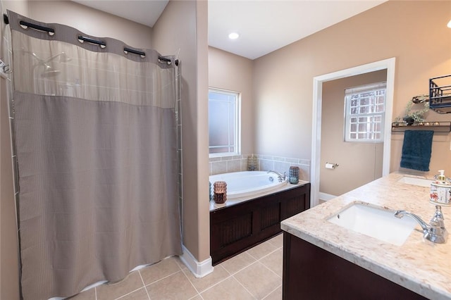 bathroom featuring tile patterned flooring, vanity, and plus walk in shower