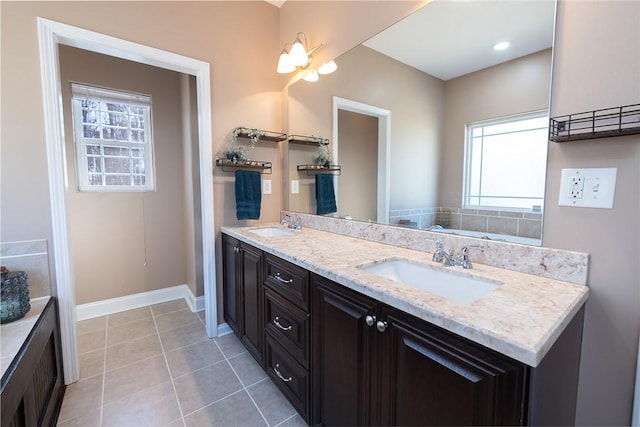 bathroom with tile patterned floors and vanity