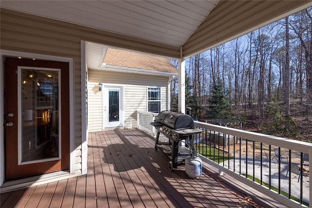 wooden terrace featuring area for grilling