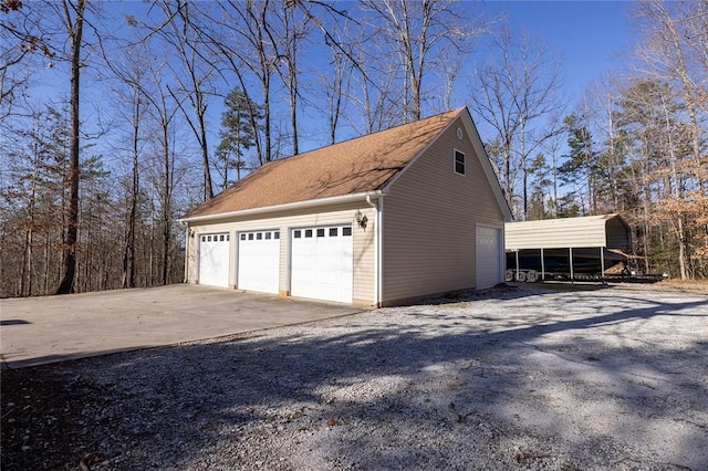 garage featuring a carport