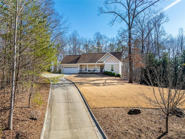 view of front of house with covered porch and a garage