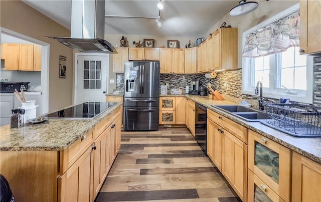 kitchen with black appliances, island range hood, sink, and light brown cabinetry