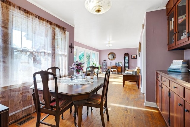 dining space with light wood-type flooring