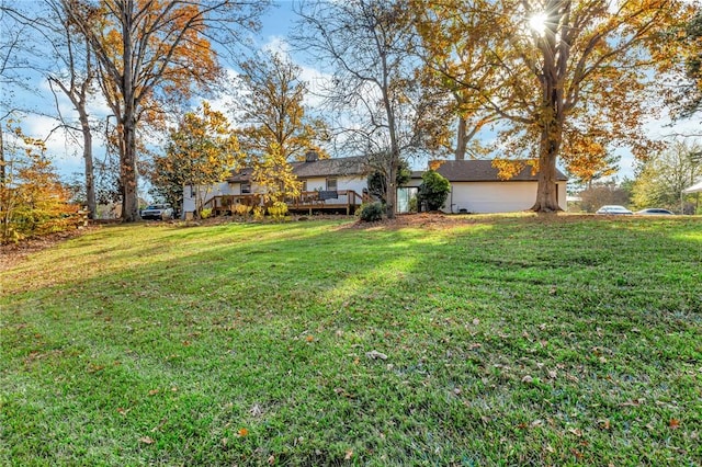 view of yard featuring a wooden deck