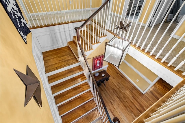 stairway featuring wood-type flooring