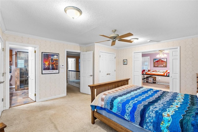 bedroom featuring a textured ceiling, ceiling fan, ornamental molding, and light carpet