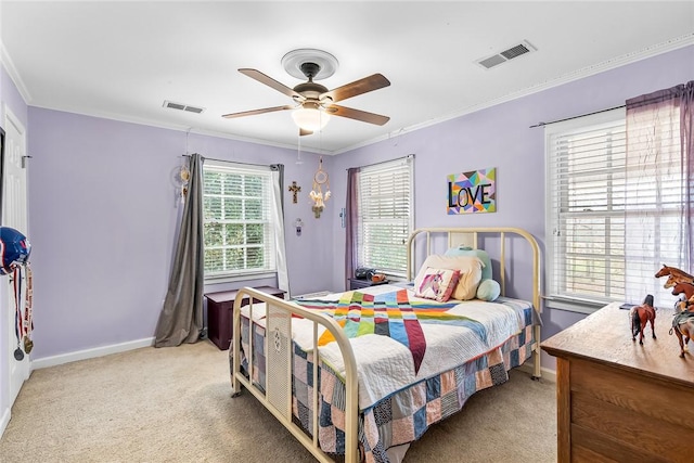 bedroom featuring ceiling fan, crown molding, and light colored carpet