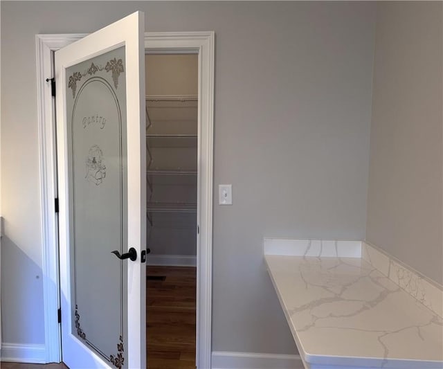 bathroom with hardwood / wood-style flooring