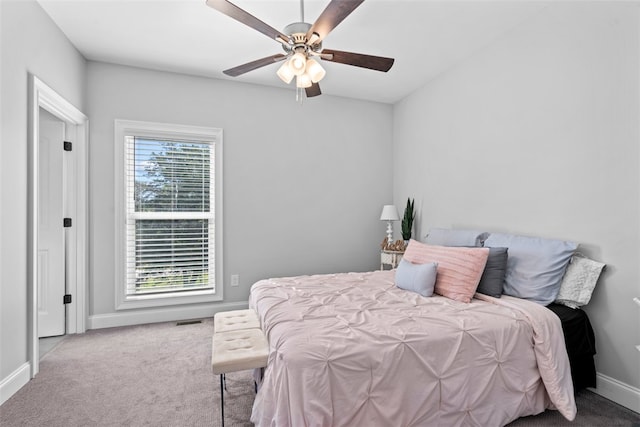 bedroom with ceiling fan and carpet floors