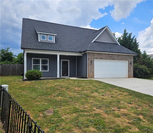 view of front facade with a front yard and a garage