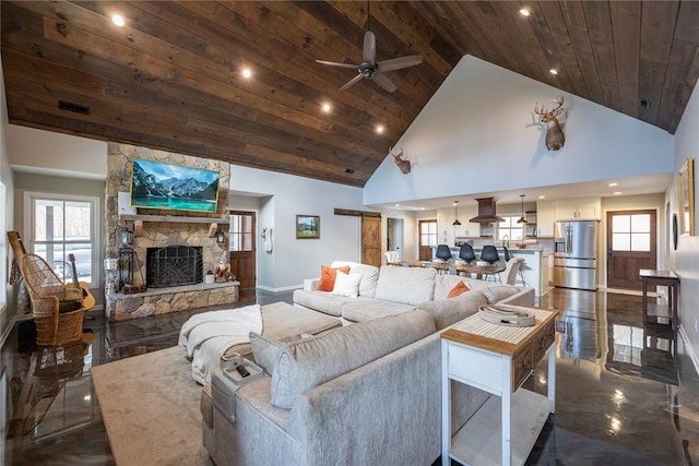 living room featuring a fireplace, high vaulted ceiling, ceiling fan, and wood ceiling