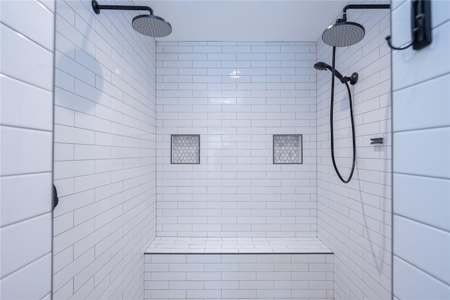 bathroom with a tile shower