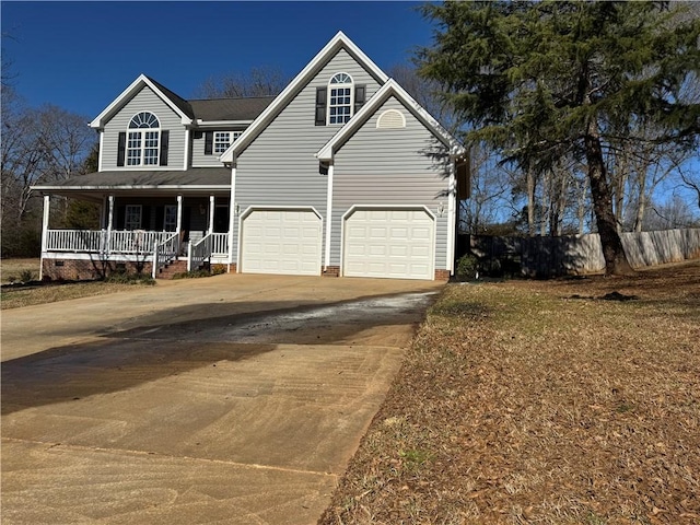 view of front of property with a porch and a garage