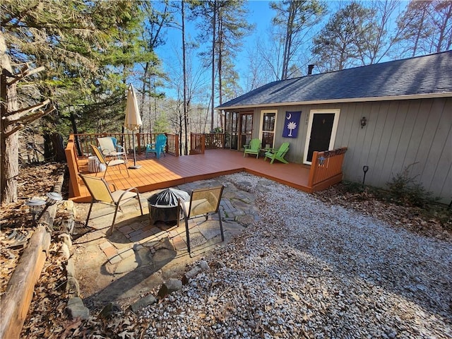 view of patio featuring a fire pit and a deck