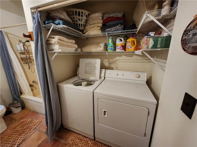 clothes washing area with separate washer and dryer