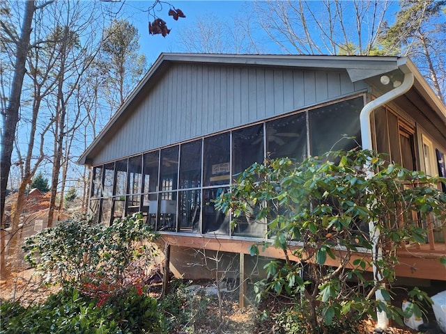 view of side of home featuring a sunroom