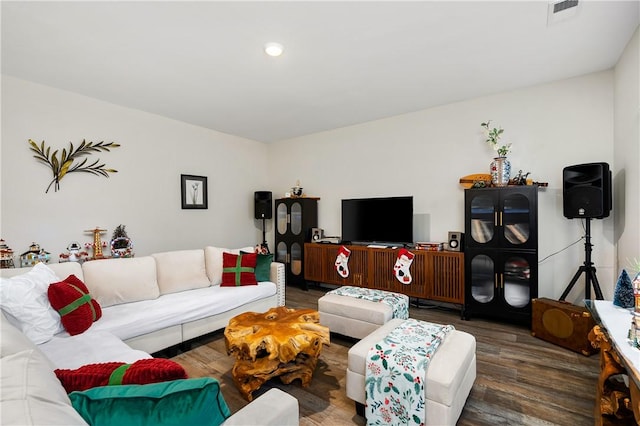 living room with dark hardwood / wood-style flooring