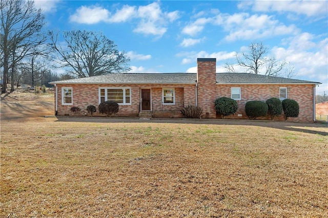 ranch-style home featuring a front yard