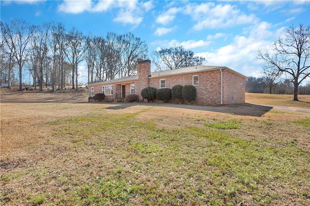 back of house with a yard