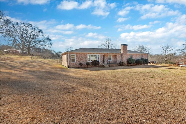 ranch-style home with a front lawn