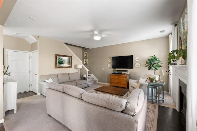 living room with hardwood / wood-style flooring and ceiling fan