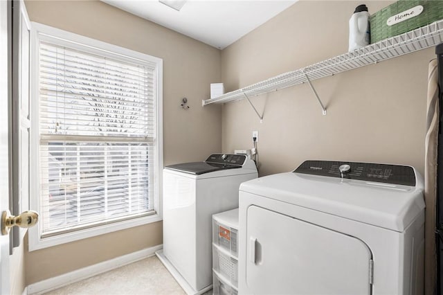 washroom with independent washer and dryer