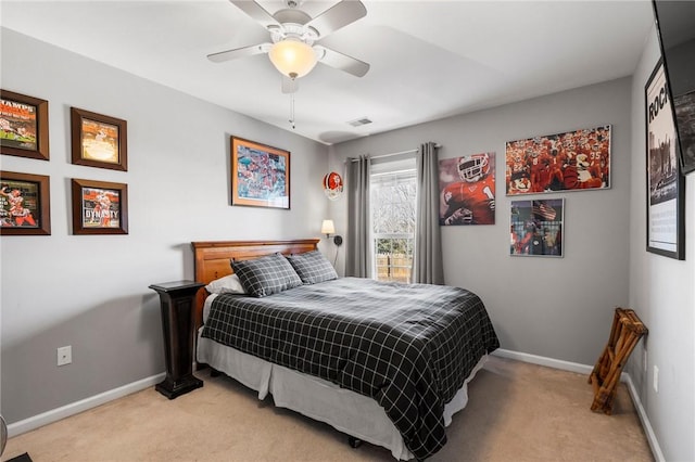 bedroom featuring ceiling fan and light colored carpet