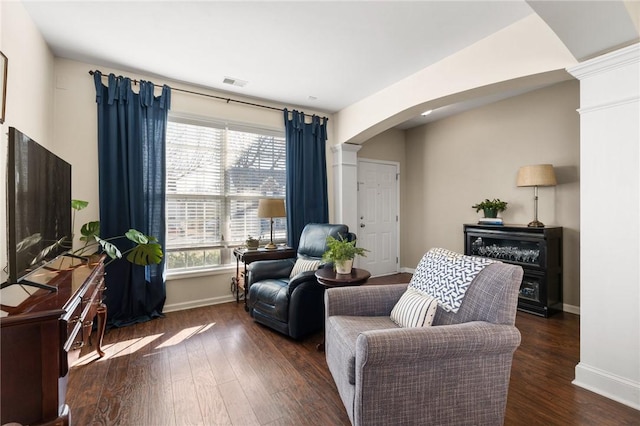 sitting room with dark wood-type flooring